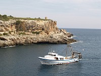  Boat coming into port, Cala Figuera