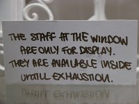  Funny sign in the window of a shop