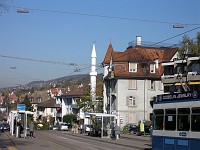  Once you move further down the road the minaret becomes visible. You can see that it is quite small compared to the buildings around it.