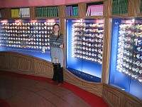  Each container is a different type of ice cream. Each type was for sale in this shop.