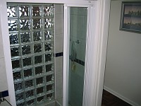  Looking across to the shower cubicle. Glass bricks join the shower cubicle to the kitchen area