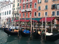  Gondolas parked outside a restaurant.